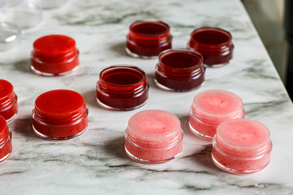 homemade lip gloss adding the koolaid lip gloss to the lip balm containers
