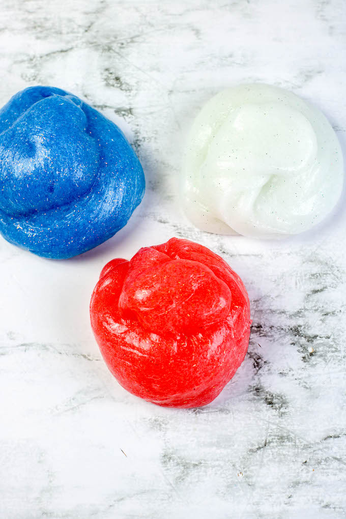balls of red white and blue slime Independence Day slime red, white and blue how to make colored slime using Elmers glue