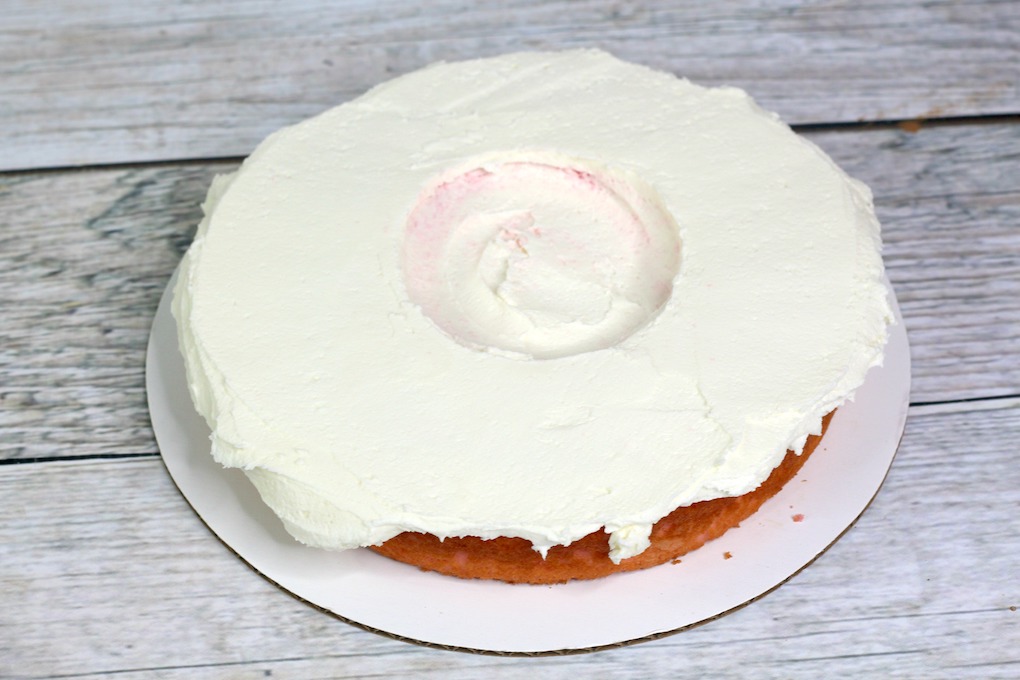 cake layer with frosting for the Jelly Bean Cake