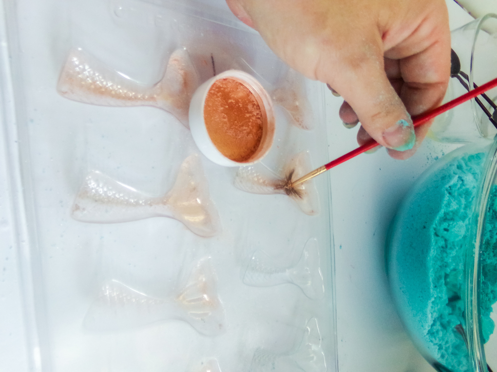 Painting the inside of the mermaid bath bomb mold