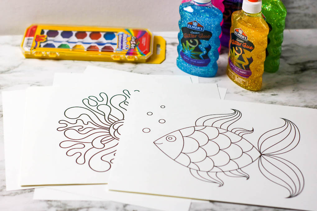 Supplies needed - glue, watercolor paint, paintbrush, and water, easy painting ideas for kids, free fish outline, free rainbow fish outline, painting using glue and glue outlines