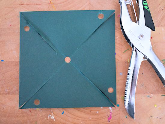 folding a square paper to make a paper pinwheel