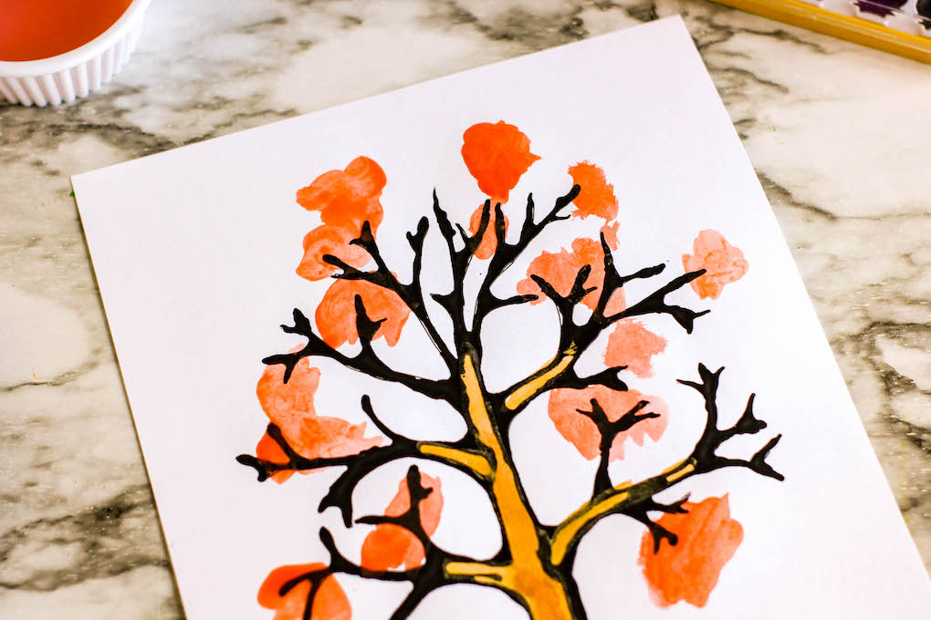 using watercolor paint to complete the black line art project free tree template