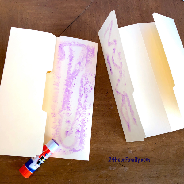Folding manilla folders to create goldilocks craft