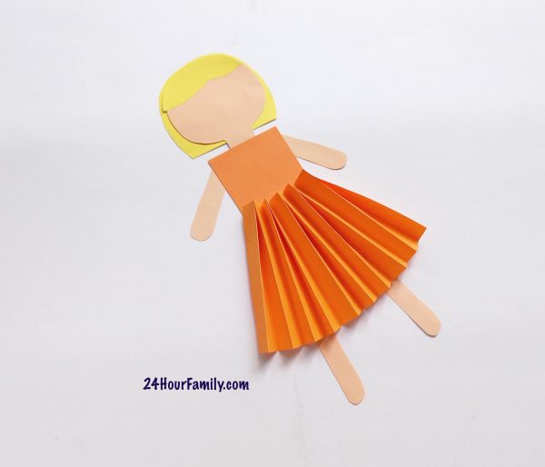 How to glue the fairy’s hands and legs with her body while make a fairy paper doll.