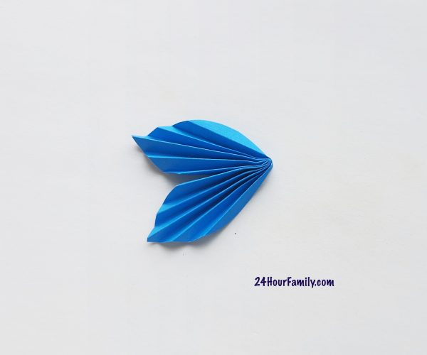 now the blue accordion folded paper resembles a fish tail