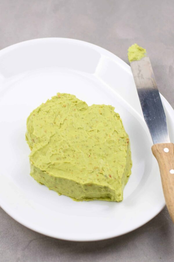 Shaping guacamole into a Grinch face