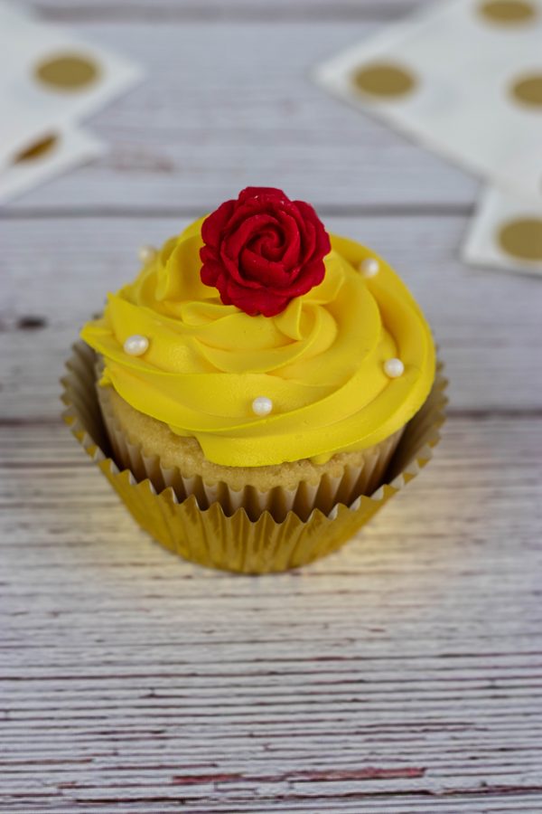 a red rose belle themed cupcake