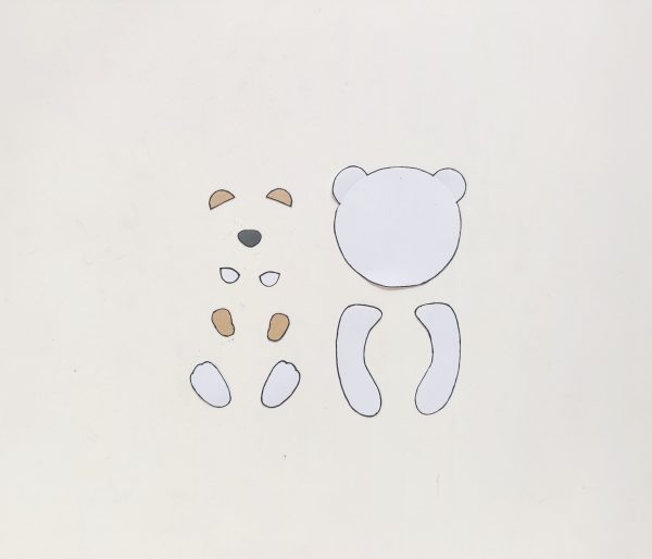cut out parts for polar bear paper roll craft winter activity for kids