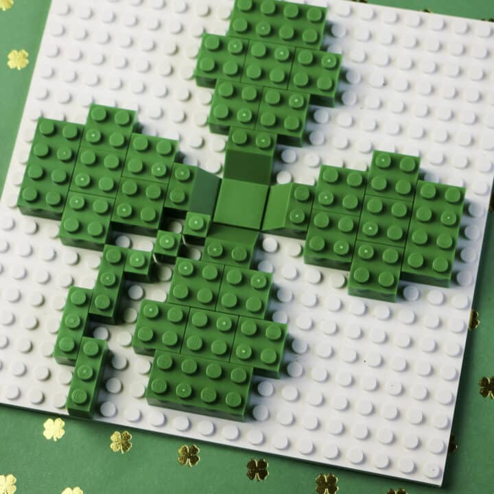 Build a lego shamrock using green and white legos
