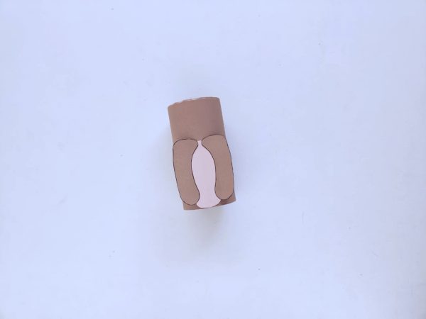 Brown paper roll with cut-out pink oval and cut-out brown legs