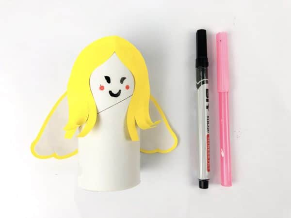 Yellow angel hair cutout beside colorful scissors, Angel cutout template with white glue and colorful scissors, How to Make an Angel Toilet paper Craft with Free Angel template, DIY Angel Toilet Paper Craft with yellow halo and wings, Angel Craft, Angel Toilet paper Roll, Angel' Wings, Crafts For Kids, Craft supplies for angel DIY: paper roll, scissors, markers, and glue, Cut-out angel craft pieces and colorful scissors, Toilet paper roll angel with yellow hair and pink and black markers