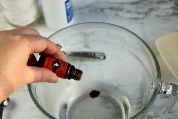 Easy DIY Strawberry slime recipe for kids to make at home, simple slime recipe containing elmer's glue, baking soda, borax contact lens solution essential oil
