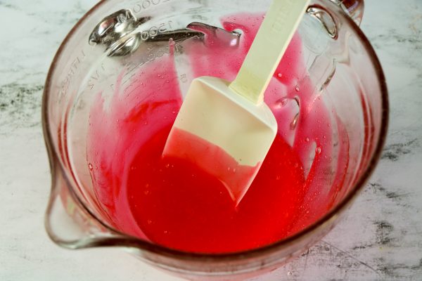 Easy DIY Strawberry slime recipe for kids to make at home, simple slime recipe containing elmer's glue, baking soda, borax contact lens solution essential oil