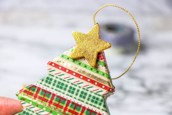 Adding a star to a Christmas ornament easy christmas craft for kids