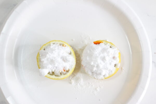 add baking soda to a lemon to make a fizzy reaction