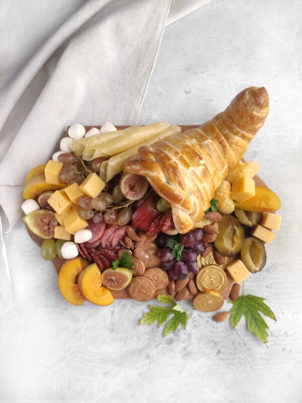 Overhead view of a Thanksgiving cornucopia charcuterie board.