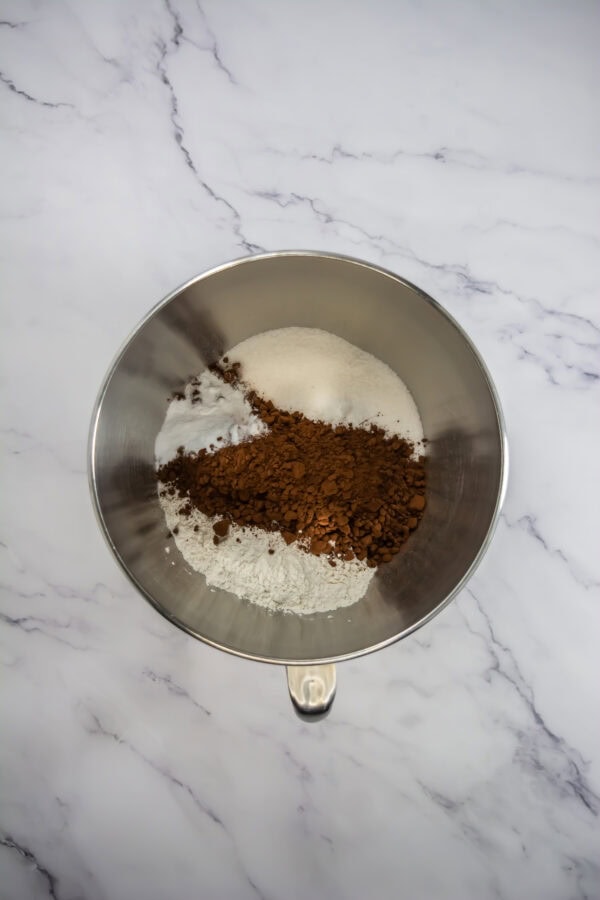 These are super easy to prepare, starting with a large microwave-safe bowl where you mix your ingredients whisk together the flour, cocoa powder, baking powder, and salt