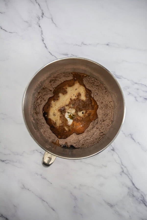Gradually add the dry ingredients to the wet mixture, alternating with the milk. Begin and end with the dry ingredients