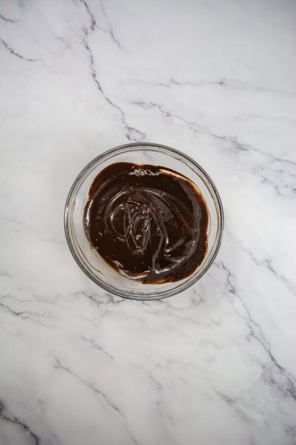 Let it sit for 1-2 minutes, then stir until the chocolate is completely melted and smooth. Stir in the vanilla extract.
