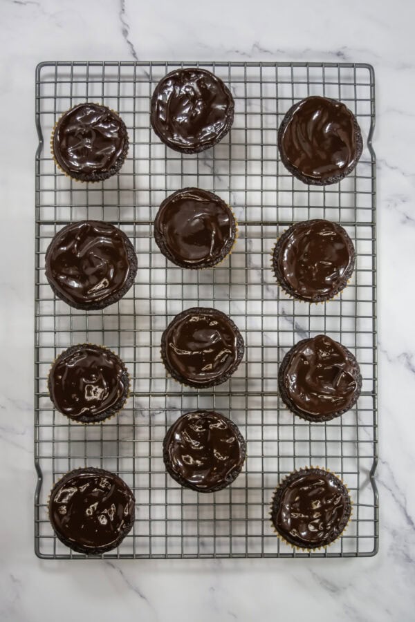 Dip the upper part of each muffin into the ganache or spread it on with a knife to coat it evenly.