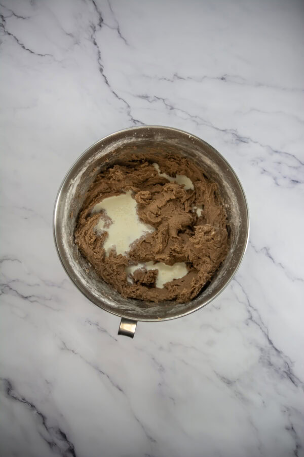 Slowly pour in the hot water (or hot cocoa mix if you want a more intense chocolate flavor)