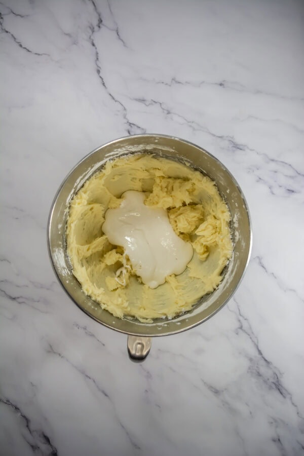 Cream the butter: In a large bowl, beat the softened butter until smooth and fluffy.