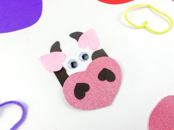 Printable Valentine’s cow with heart, DIY Valentine’s cow bookmark, Simple Valentine’s day cow craft ideas, Cute cow Valentine’s art print, Valentine’s day cow love printable, Cow and heart DIY Valentine’s craft