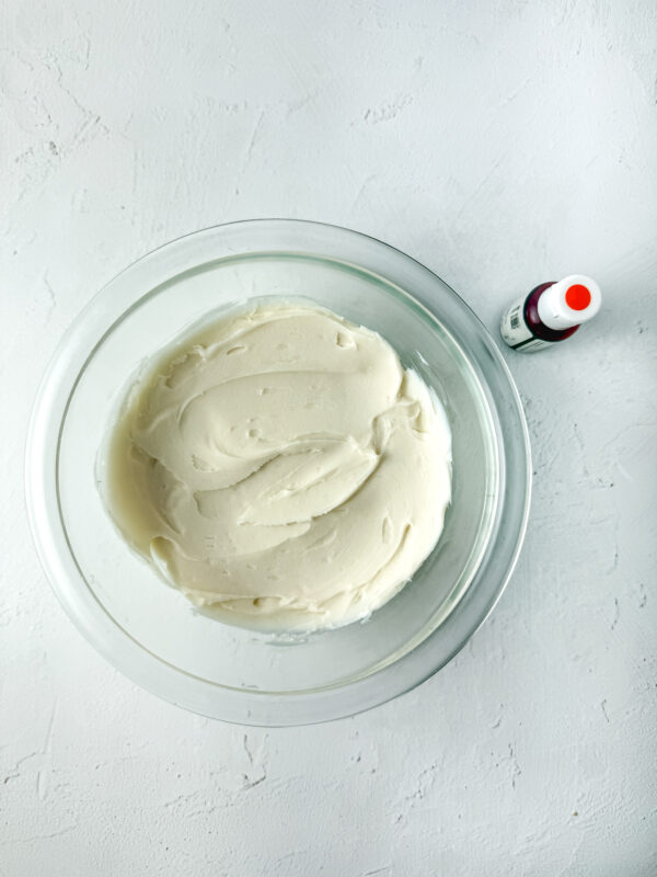 piping the orange frosting 