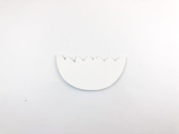 A cutout of a cracked eggshell.
