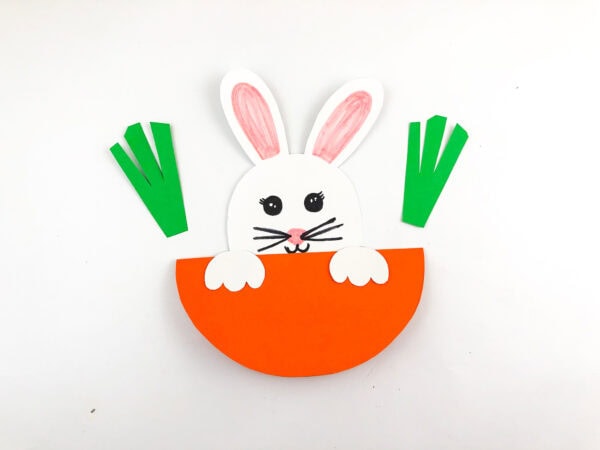 Bunny with green carrot tops attached to the sides.