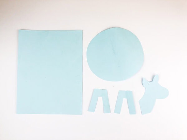 Cutout blue and white paper sheets cut out in the background.
