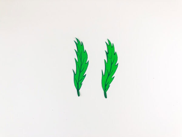 Two cut-out green palm leaves.
