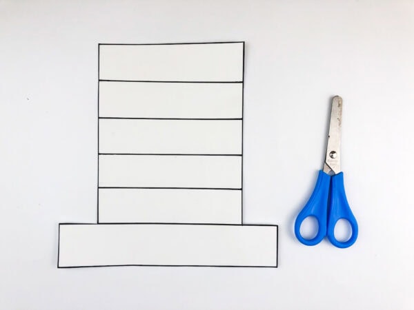 Hat outline on white paper with scissors