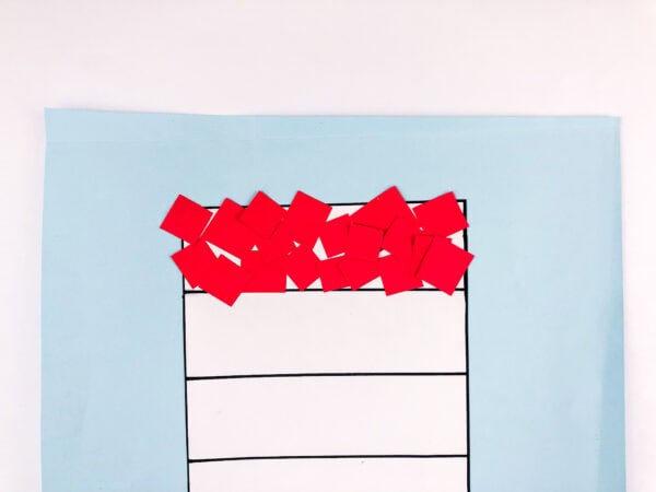 Red squares glued to the top of the hat
