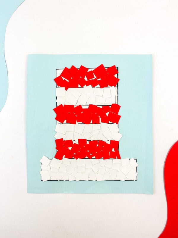 The final craft piece with the hat fully covered in red and white squares