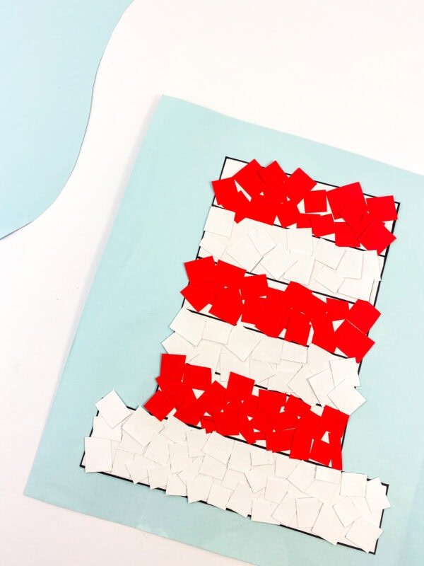 The final craft piece with the hat fully covered in red and white squares