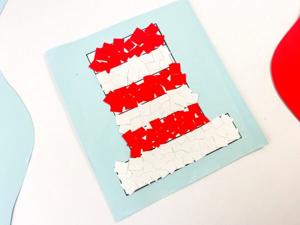 The final craft piece with the hat fully covered in red and white squares