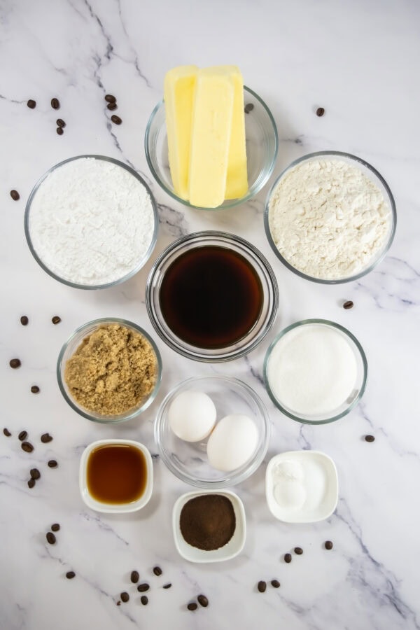 Ingredients for espresso cupcakes including butter, flour, eggs, sugar, and coffee.