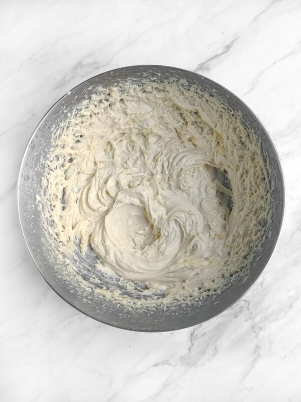 Bowl of mixed whipped buttercream frosting.