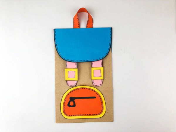 Paper bag backpack with orange pocket and blue flap attached