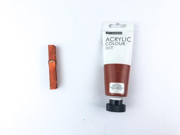 Painted clothespin with brown acrylic paint.