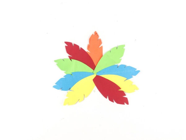 Colorful paper feathers arranged in a circle.