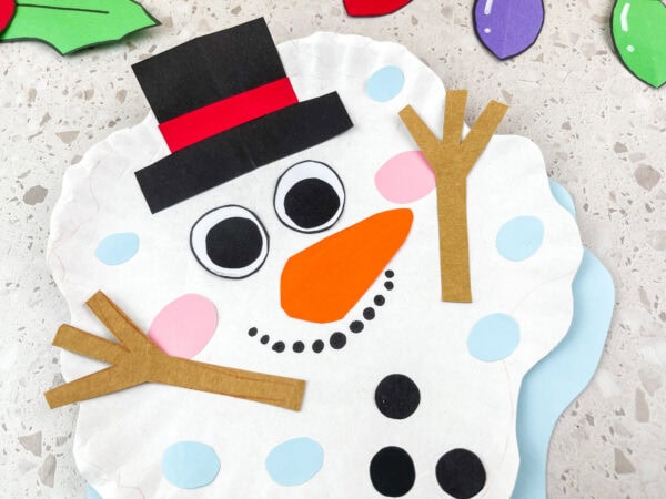 Close-up of melted snowman paper plate craft.