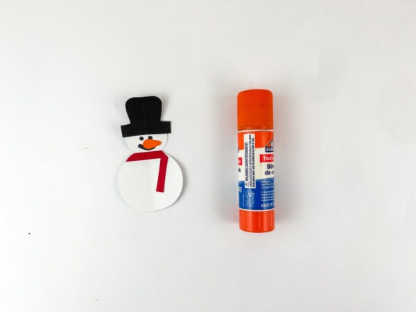 Assembled snowman pieces with glue stick