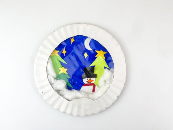 Almost finished snow globe craft with snowman and trees