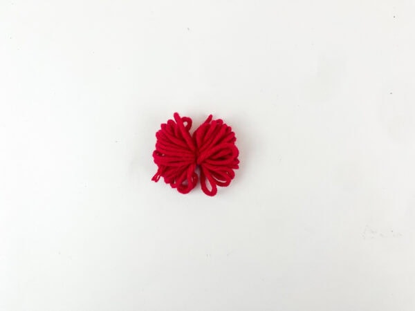 Red yarn loop bundle for reindeer nose