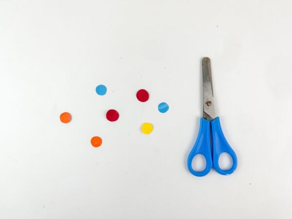 Small colorful paper circles cut out with scissors