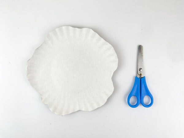 Paper plate cut into a melted snowman shape.
