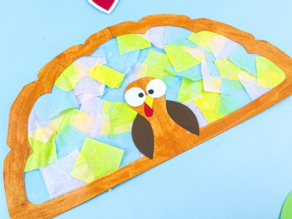 Close-up of finished turkey suncatcher craft.